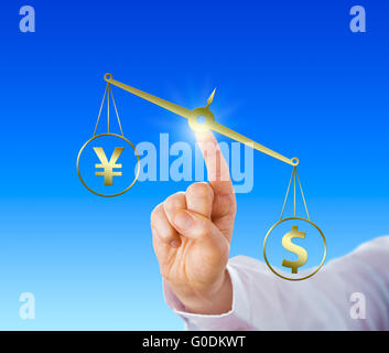 Dollar Outweighing The Yen On A Golden Balance Stock Photo