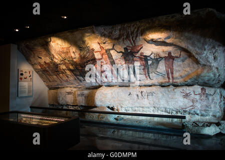 MEXICO CITY, Mexico — A reproduction of the Painted Cave of San Francisco Sierra at the National Museum of Anthropology (Museo Nacional de Antropología) showcases prehistoric Mexican cave art. The original site in northern Mexico features paintings in red, black, white, and yellow depicting animals and female figures associated with fertility rituals. This exhibit recreates one of Mexico's most significant prehistoric ceremonial centers. Stock Photo