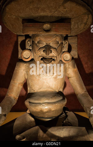 MEXICO CITY, MEXICO--A statue of Huehuetéotl, the Aztec God of Fire, at the National Museum of Anthropology. The National Museum of Anthropology showcases  significant archaeological and anthropological artifacts from the Mexico's pre-Columbian heritage, including its Aztec and indiginous cultures. Stock Photo