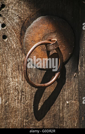 Rusty iron fittings hardware of old weathered door Stock Photo