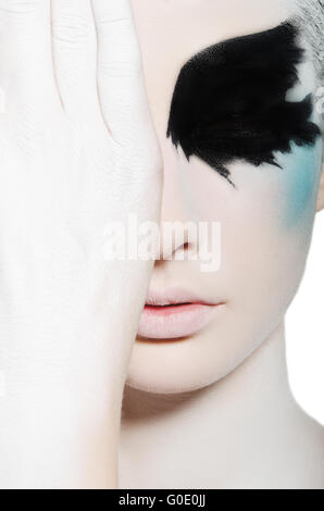 Beautiful woman with black and white face art Stock Photo