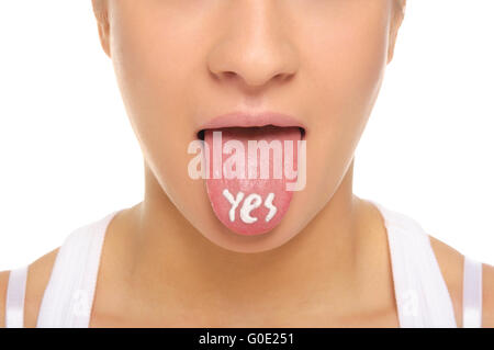 Woman puts out the tongue with an inscription yes Stock Photo