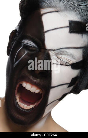 Portrait of screaming woman with face art as piano Stock Photo