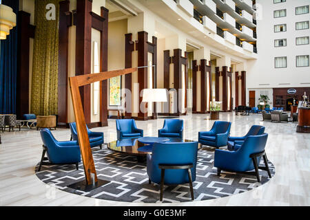 Modern blue chair & lamp grouping as artistic centerpiece in the beautiful lobby of the Downtown Nashville Hilton Hotel, TN Stock Photo