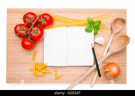 Cookery book arranged on wooden board with differe Stock Photo