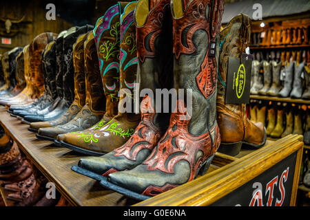 The Nashville Cowboy boot store has rows of unique Cowboy boots for sale in the downtown entertainment district in Nashville TN Stock Photo