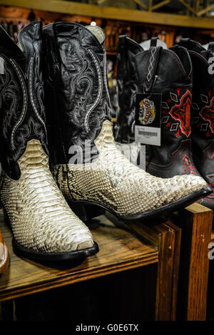 The Nashville Cowboy boot store has rows of unique Cowboy boots for sale in the downtown entertainment district in Nashville TN Stock Photo