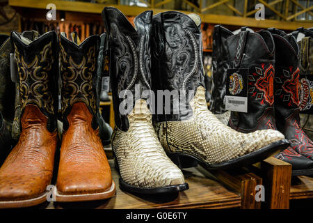 The Nashville Cowboy boot store has rows of unique Cowboy boots for sale in the downtown entertainment district in Nashville, TN, Music City, USA Stock Photo