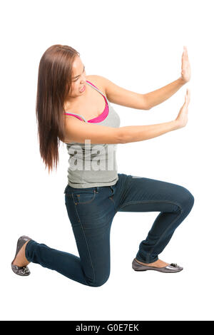 Woman Kneeling Arms Pushing Against Side Object Stock Photo