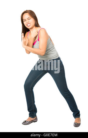 Straining Woman Leaning Shoulder Against Object Stock Photo