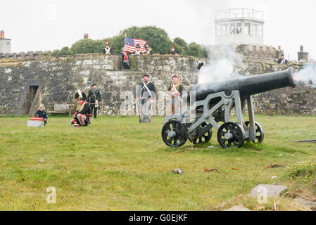 Fort Belan, Caernarfon, Gwynedd, UK. 1st May, 2016. Seven year old Elissa Gibson, far left, won the opportunity to fire the 24 pound cannon at  Fort Belan, supervised by Yaron Thau, left, of the Anglesey Hussars, as part of the Bank Holiday  fund raising to restore Fort Belan, a Napoleonic era fort in north west Wales. Credit:  Michael Gibson/Alamy Live News Stock Photo