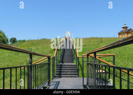 Metal stairs with railings leading up Stock Photo