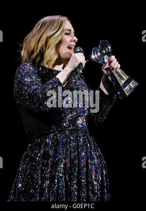 Adele wins an award whilst on stage in Birmingham as she wraps her UK tour. Adele was presented the iHeartRadio music awards gong for best song and gave an acceptance speech mid concert at the Genting Arena in Birmingham as she wraps her UK Tour this week.  Featuring: Adele Adkins Where: Birmingham, United Kingdom When: 30 Mar 2016 Stock Photo