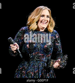 Adele wins an award whilst on stage in Birmingham as she wraps her UK tour. Adele was presented the iHeartRadio music awards gong for best song and gave an acceptance speech mid concert at the Genting Arena in Birmingham as she wraps her UK Tour this week.  Featuring: Adele Adkins Where: Birmingham, United Kingdom When: 30 Mar 2016 Stock Photo