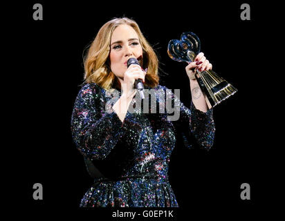 Adele wins an award whilst on stage in Birmingham as she wraps her UK tour. Adele was presented the iHeartRadio music awards gong for best song and gave an acceptance speech mid concert at the Genting Arena in Birmingham as she wraps her UK Tour this week.  Featuring: Adele Adkins Where: Birmingham, United Kingdom When: 30 Mar 2016 Stock Photo