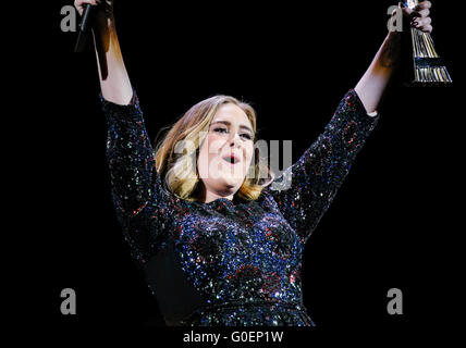 Adele wins an award whilst on stage in Birmingham as she wraps her UK tour. Adele was presented the iHeartRadio music awards gong for best song and gave an acceptance speech mid concert at the Genting Arena in Birmingham as she wraps her UK Tour this week.  Featuring: Adele Adkins Where: Birmingham, United Kingdom When: 30 Mar 2016 Stock Photo