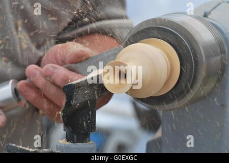 Working on wood lathe Stock Photo