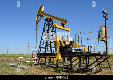 Pumping unit as the oil pump installed on a well Stock Photo