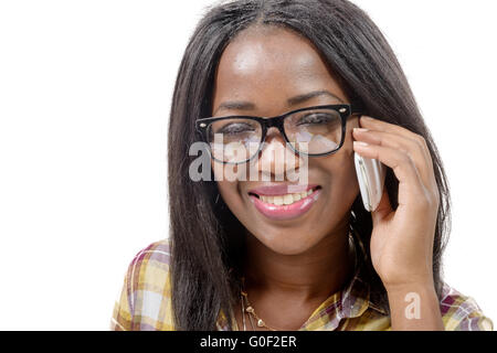 Portrait of a beautiful young african woman talking on cell phone against white background Stock Photo