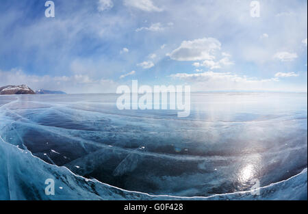 Winter ice landscape on Siberian lake Baikal with clouds Stock Photo