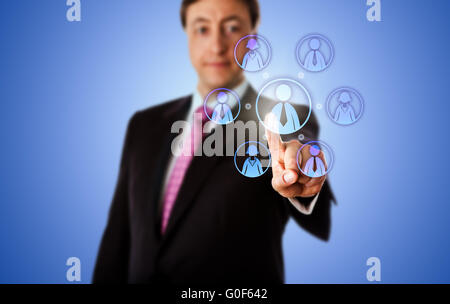 Smiling Consultant Contacting A Virtual Work Team Stock Photo