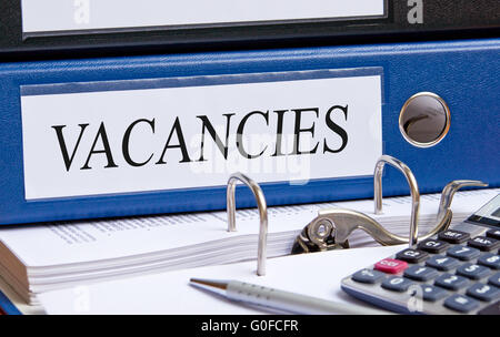 Vacancies - blue binder in the office Stock Photo