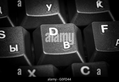 Electronic collection - detail black computer keyboard with russian letter. Focus on the center key. Stock Photo