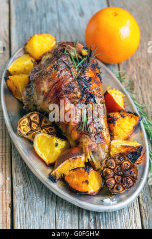 Dish with roasted turkey thigh. View from above. Stock Photo