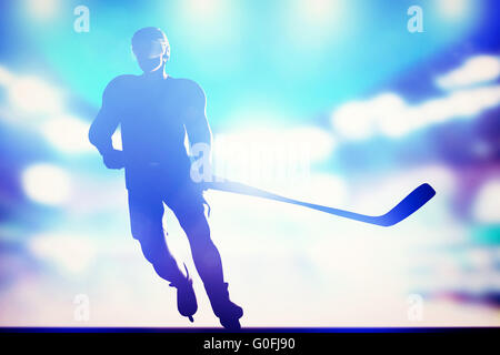 Hockey player skating on ice in full arena night lights Stock Photo