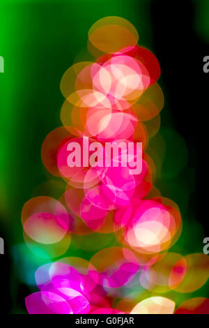 Christmas tree background of true camera bokeh. Glitter and light abstract. Stock Photo