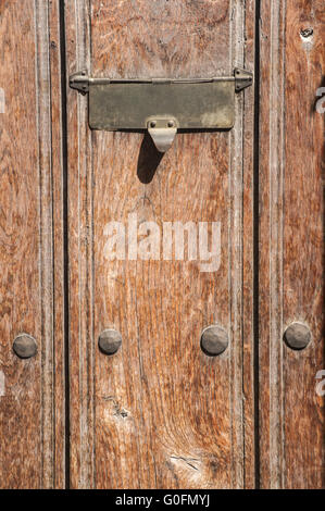 Slot in mailbox on old vintage wooden door Stock Photo