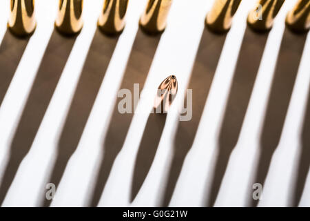 Macro shot of bullet casings on a white studio background Stock Photo