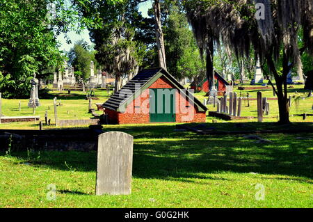 New Bern, North Carolina: Stone tombstones and brick above-ground burial vault at historic Cedar Grove Cemetery  * Stock Photo