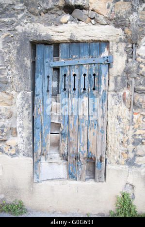Boarded-up window on the stone wall, Stock Photo