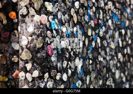 Part of Berlin Wall with graffiti and chewing gums Stock Photo