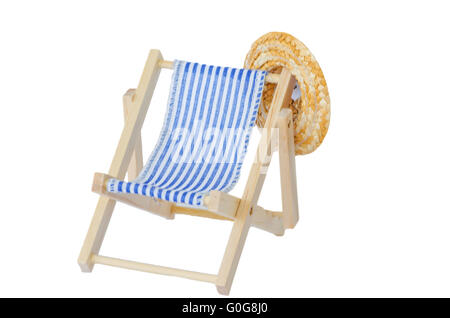Wooden deck chair with sun hat Stock Photo