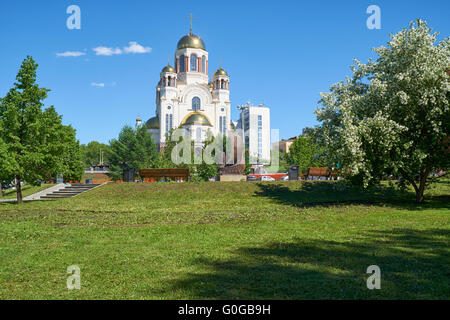 Blooming park in Yekaterinburg, with views of the Church on Blood in Honor of All Saints Resplendent in the Russian Land. monume Stock Photo