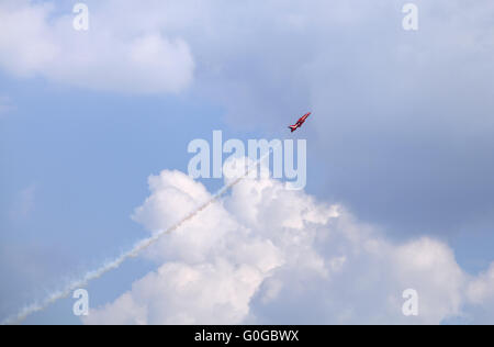 Plane on an air show against blue sky Stock Photo