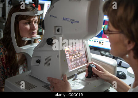 Optician examining womans vision