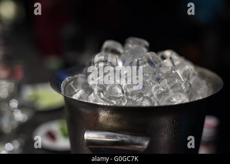 Ice bucket with ice cubes Stock Photo
