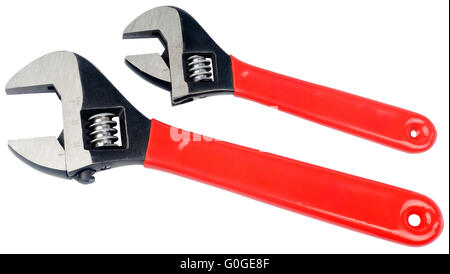 Pair of adjustable steel spanners with red plastic handle isolated on white Stock Photo