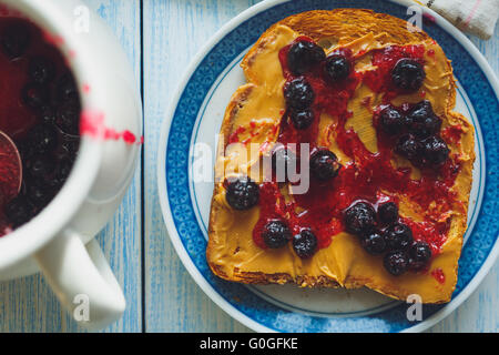 Sandwich with peanut butter and black currant jam Stock Photo