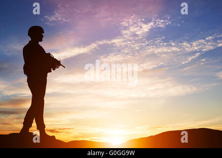 Armed soldier with rifle. Guard, army, military, war. Stock Photo