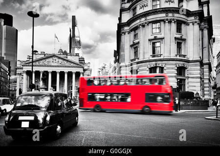 Bank of England, the Royal Exchange in London, the UK. Black taxi cab and red bus. Stock Photo