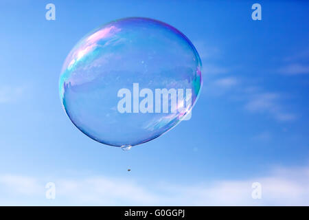 One clean soap bubble flying in the air, blue sky. Vintage Stock Photo ...