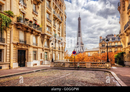 Eiffel Tower seen from the street in Paris, France.  Cobblestone pavement Stock Photo