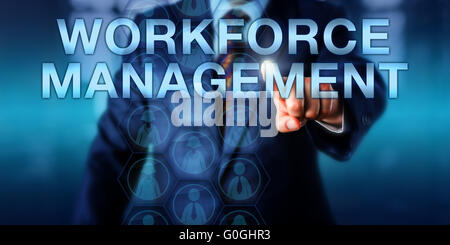 HR Manager Pushing WORKFORCE MANAGEMENT Stock Photo