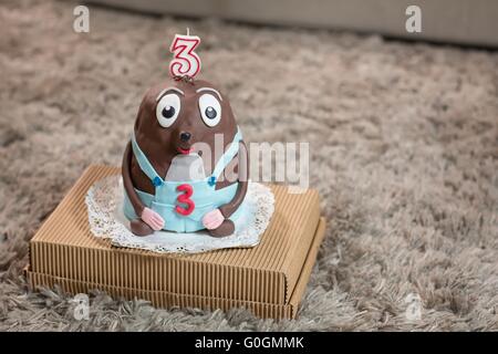 Birthday-anniversary cake with candles showing Nr.3 Stock Photo