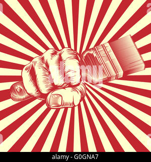 An original design of a fist holding a paintbrush in vintage propaganda poster wood cut style Stock Photo