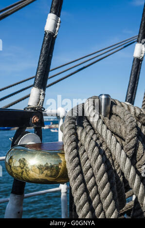 The ropes braided in bays on an ancient sailing vessel Stock Photo